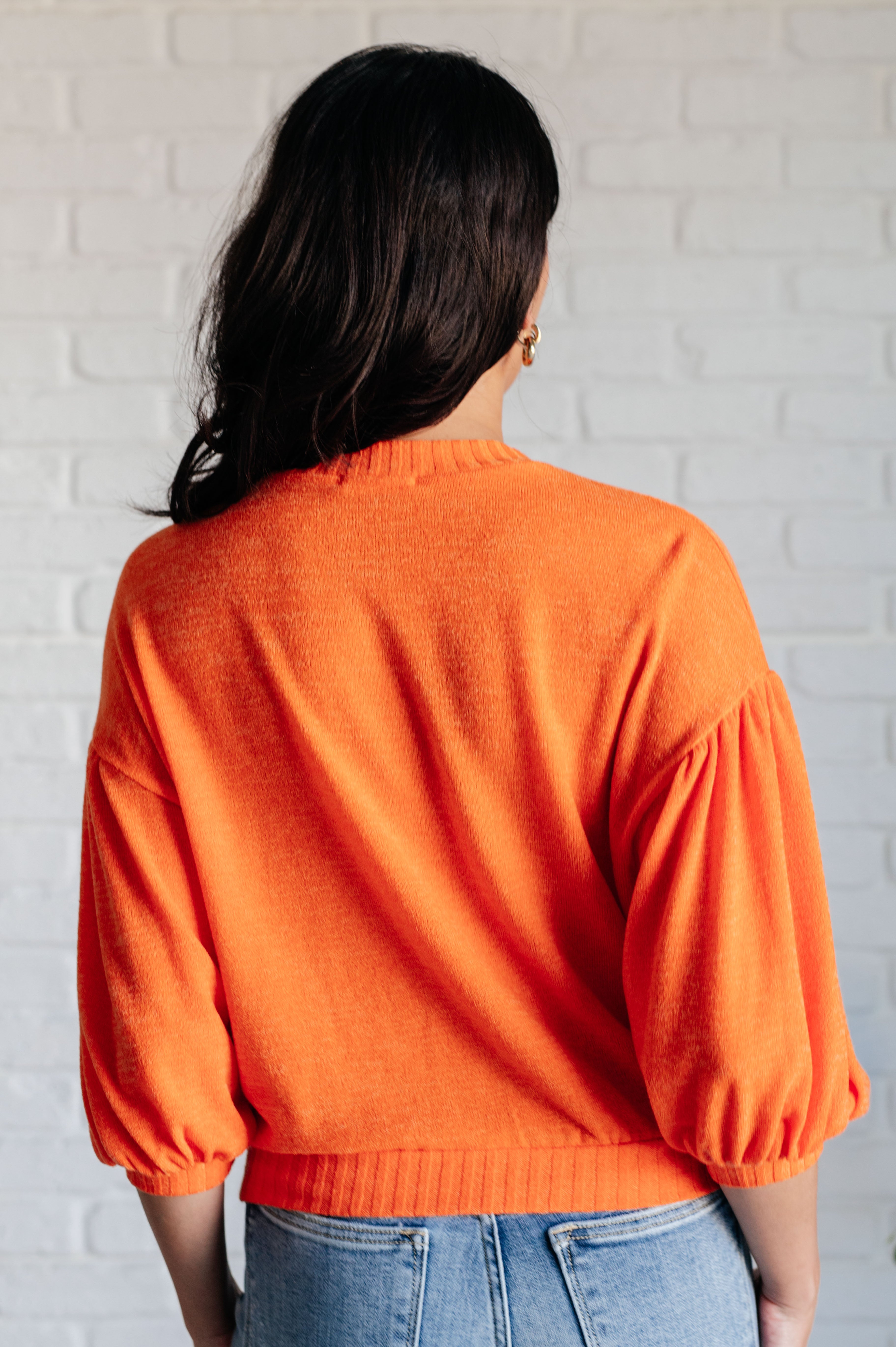 Geegee Subway Station Sweater in Orange Tops