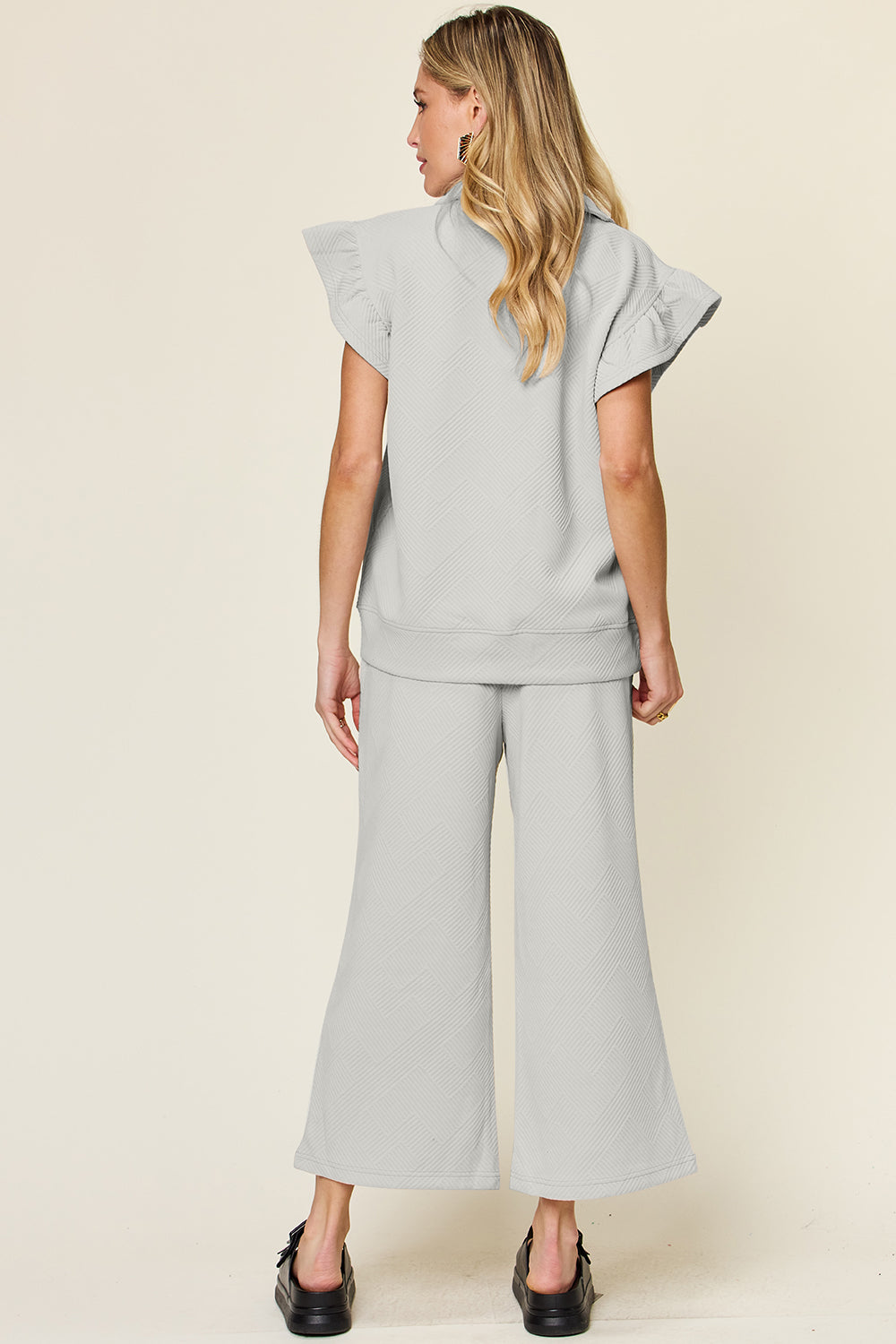 Double Take Quilted Textured Ruffle Short Sleeve Top and Drawstring Wide Leg Pants Set Trendsi