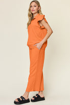 Double Take Quilted Textured Ruffle Short Sleeve Top and Drawstring Wide Leg Pants Set Trendsi