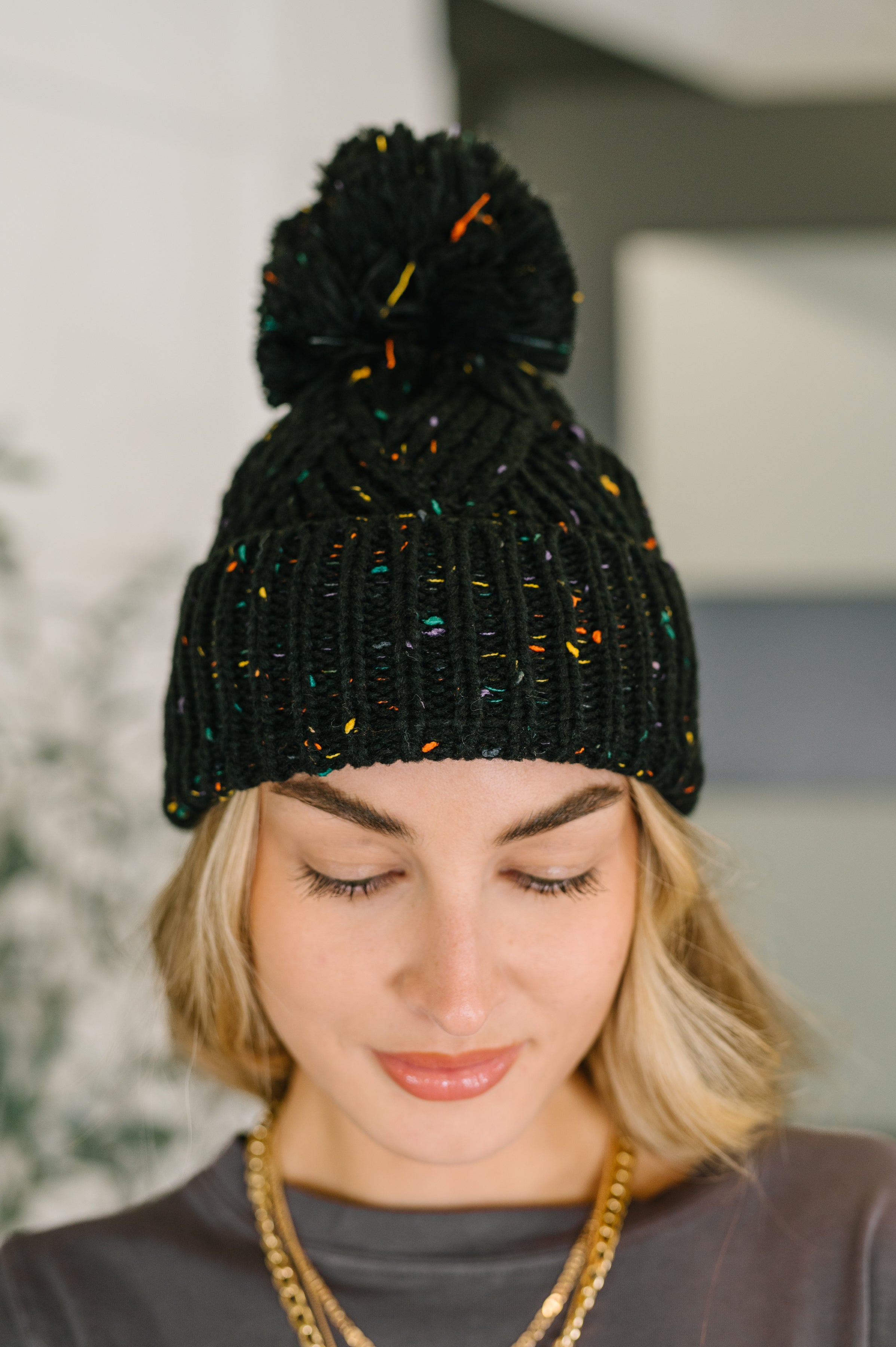 Cover Your Ears Pom Pom Beanie in Black Womens