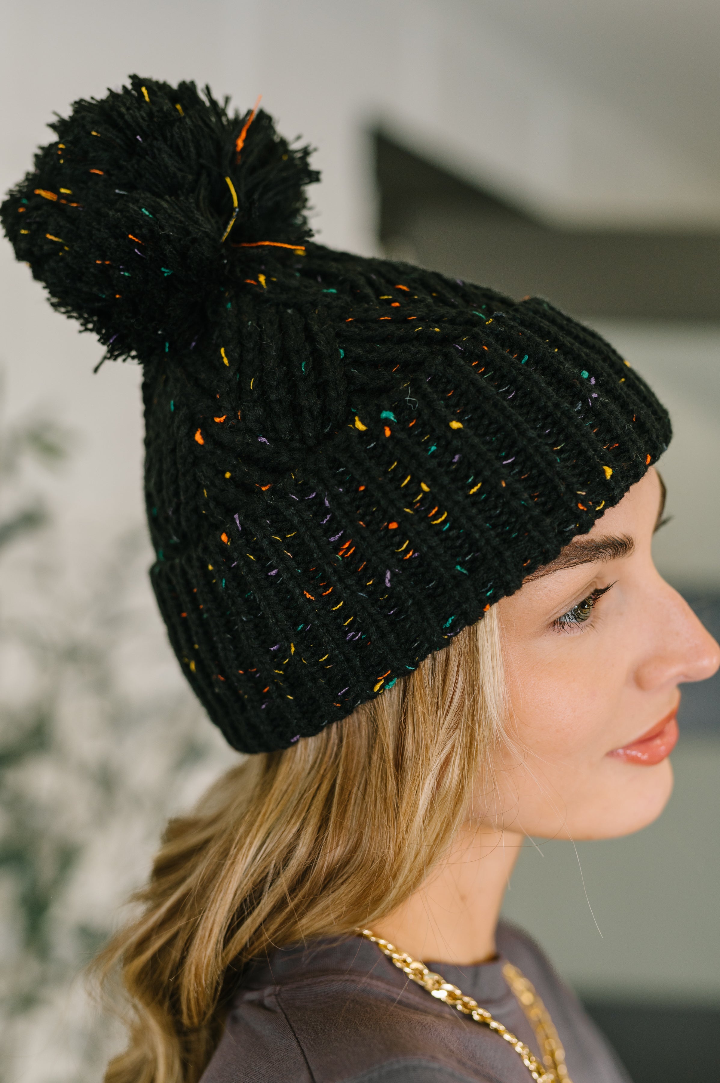 Cover Your Ears Pom Pom Beanie in Black OS Womens