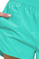 Zenana Turquoise Windbreaker Smocked Waistband Running Shorts