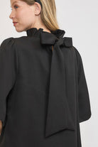 Umgee Bow Tie Back Mock Neck Half Sleeve Blouse in Black Shirts & Tops