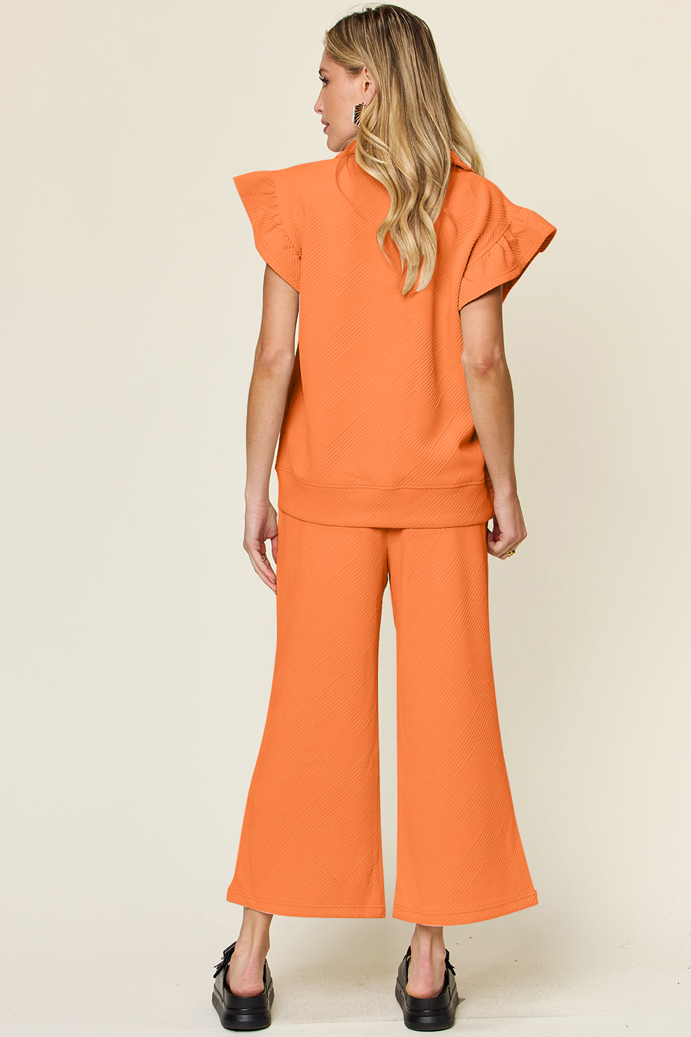 Double Take Quilted Textured Ruffle Short Sleeve Top and Drawstring Wide Leg Pants Set Trendsi